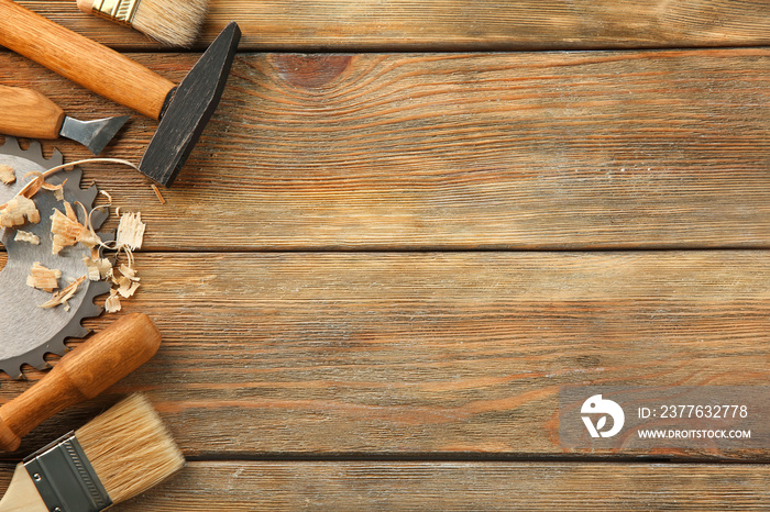 Set of carpenter’s tools on wooden background