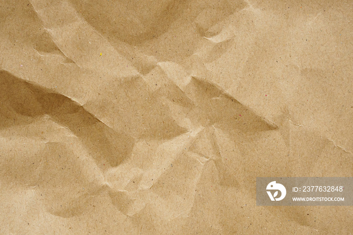 Brown crumpled paper recycled kraft sheet texture background