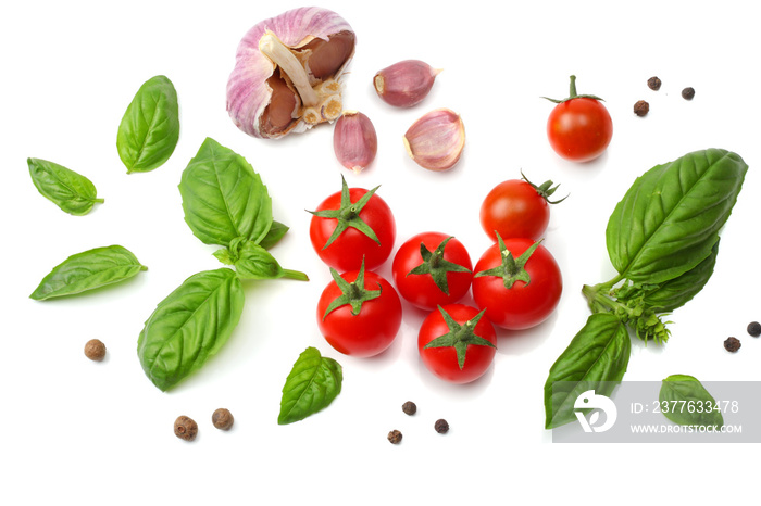 mix of slice of tomato, basil leaf, garlic and spices isolated on white background. top view