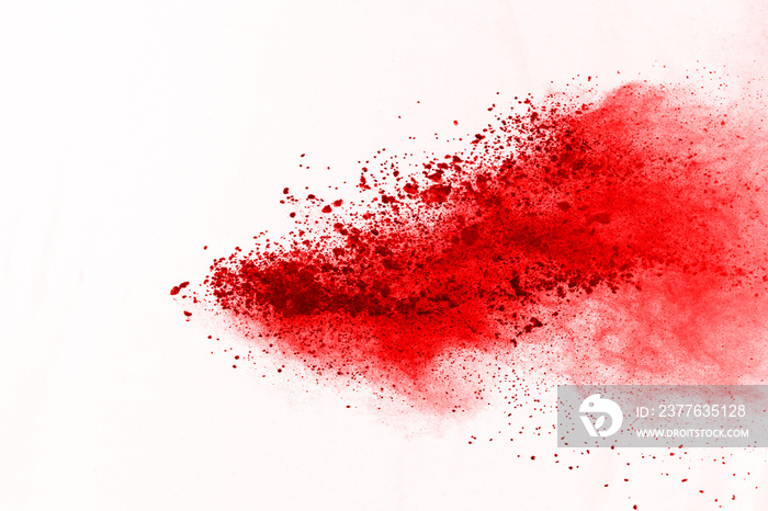 abstract powder splatted background. Red powder explosion on black background. Colored cloud. Colorful dust explode. Paint Holi.