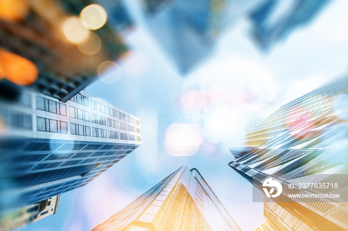 Sunny office buildings from low angle view on blue sky background