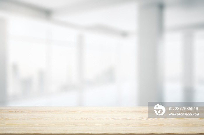 Blank wooden desktop with empty space on modern office interior with large window background, closeup, mock up