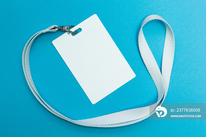 Blank badge or ID pass isolated on blue background, clipping path included