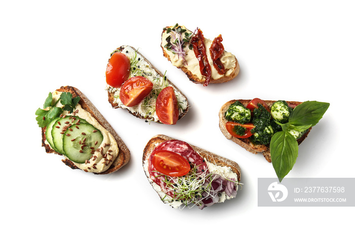 Fresh tasty bruschettas on white background