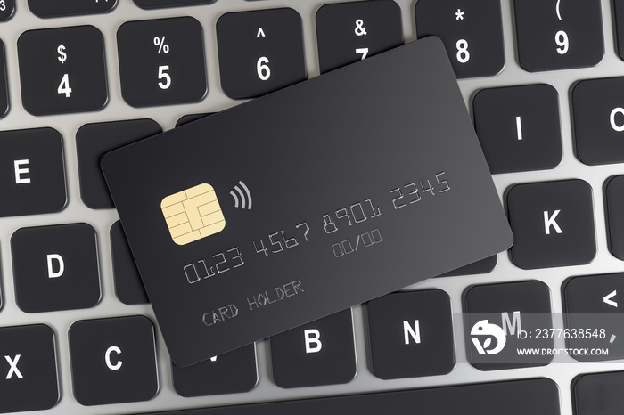 Online shopping concept with black credit card on computer keyboard