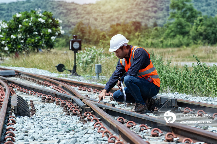 worker on a railroad. worker on the railway.  engineer Sitting on railway inspection. construction worker on railways. Engineer work on railway.rail,engineer,Infrastructure