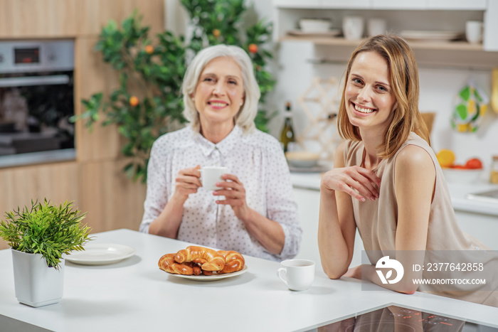 Cheerful young woman spending time with her parent