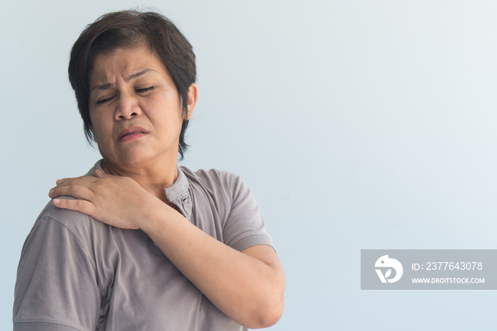 old senior woman suffers from shoulder joint pain or osteoporosis