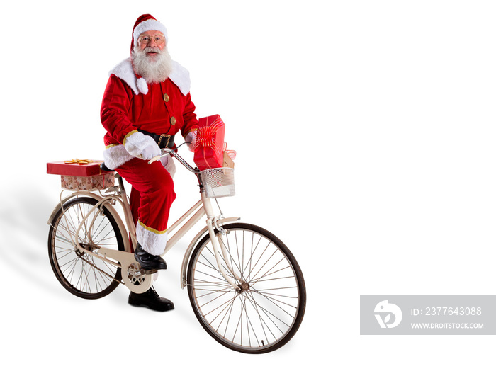 Santa Claus on bicycle delivering Christmas gifts.