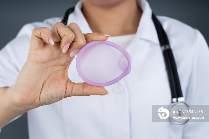 Doctor Holding Diaphragm