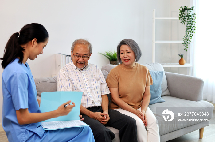 Asia woman nurse helping patient physical therapy at home.