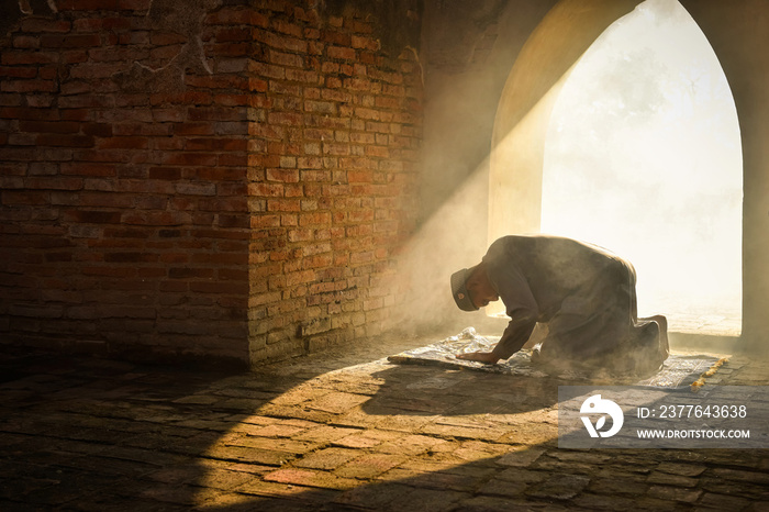 Muslim man praying at an old mosque in Phra Nakhon Si Ayutthaya Province, Thailand, Asian Muslims