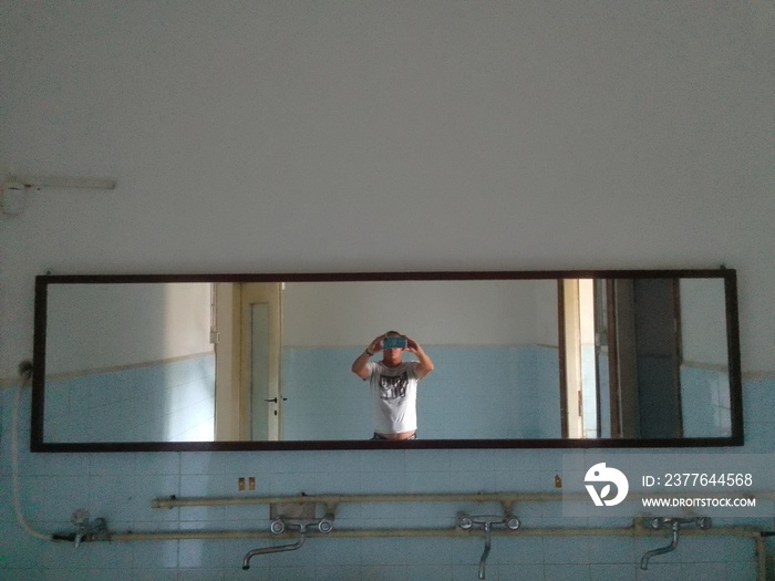 person taking selfie in a mirror