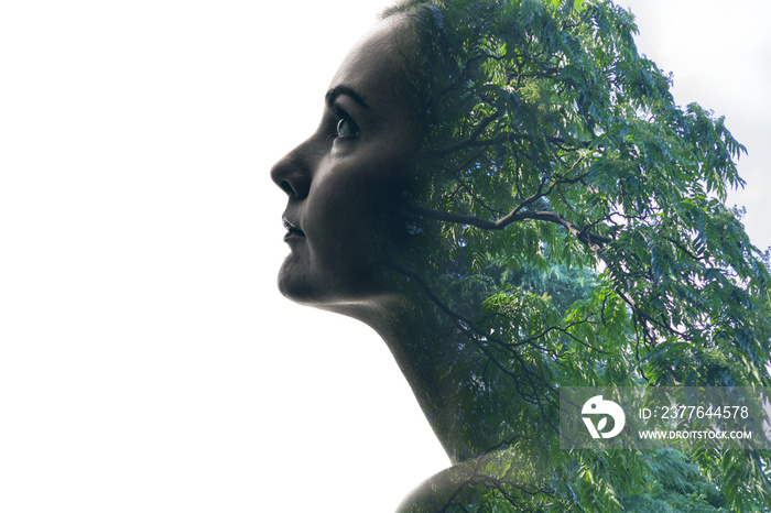 double exposure of beautiful woman and green leaves.