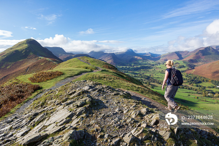 A woman walking up to Cat Bells, a peak in the Derwent Fells near Keswick in the English Lake District