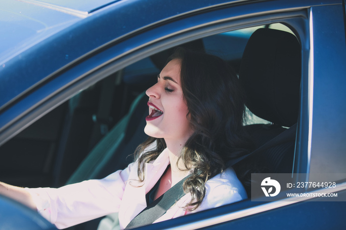 Pretty woman singing in car