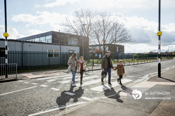 Family Safely Crossing the Road