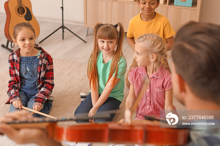 Cute little children at music school