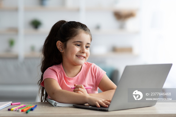 Homeschooling Concept. Cute Preteen Girl Using Laptop For Study Online At Home