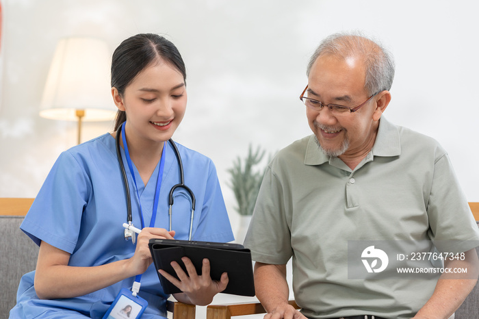 Doctor works in hospital or patient home consults to patient explains health care symptoms and help senior man, give medicines. Writing down diagnosed and symptoms, elderly care, health care concept