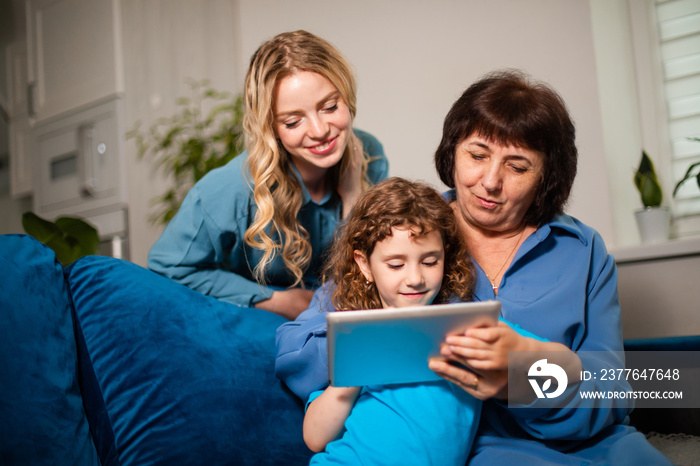 Multi-generational learning concept, senior woman learning how to use modern electronics