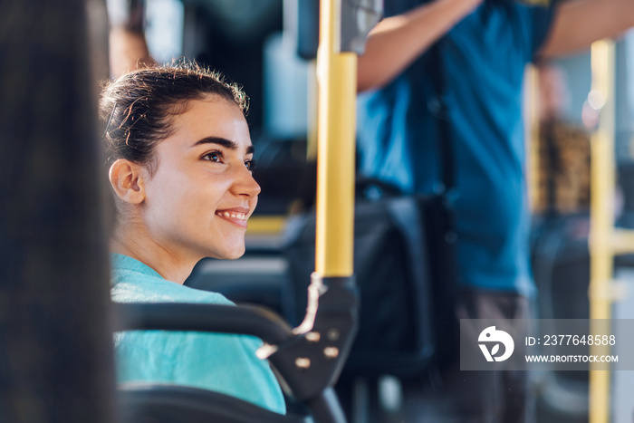 Portrait of a woman sitting in a bus