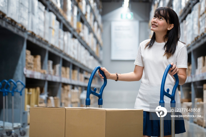 Portrait of young smart asian female shopping new lifestyle , Smiling asia woman standing between of stock product inventory on shelf compare products