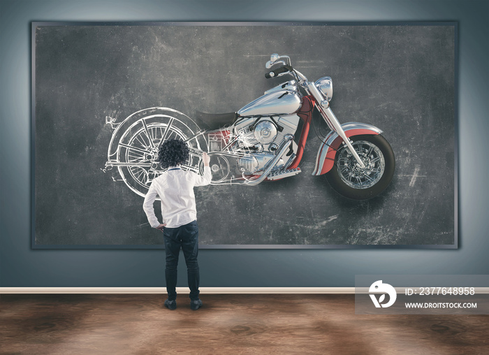 Young man with chalk draw a motorcycle