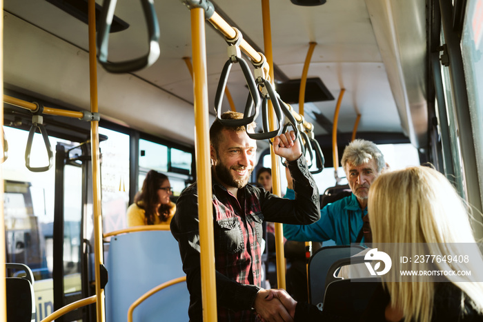 Cute young couple having fun in a public transportation