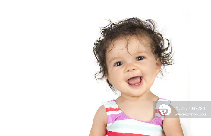 Happy, curly hair, mixed race child in stripes, isolated on white background 