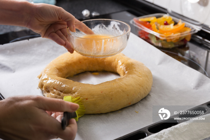 Woman hands Making homemade Roscón de Reyes