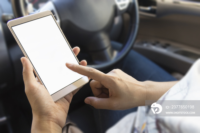 woman using her smartphone open mobile application navigation or gps in her car. Blurred car interior background. Viewing location map in smartphone during road trip