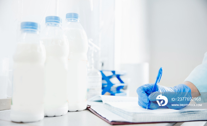 Quality control test of milk in laboratory. Dairy factory industry products