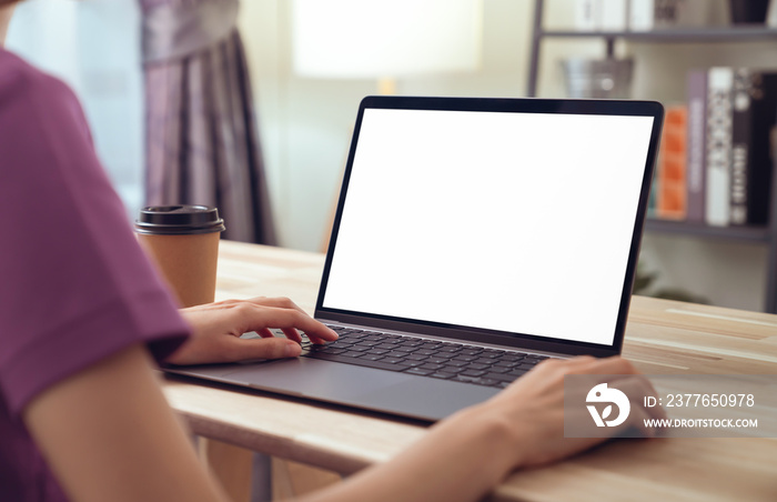 Woman hand working on laptop with blank copy space screen, mock-up for the application.