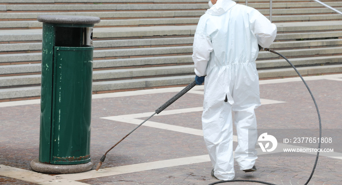 Worker with protective suit during disinfection  during the quar