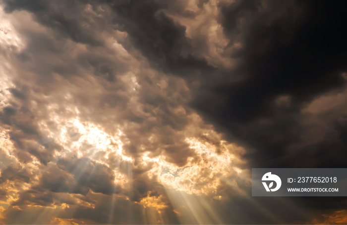 Sunlight in the sky shin over the darkness cloud before big storm coming in the raining season