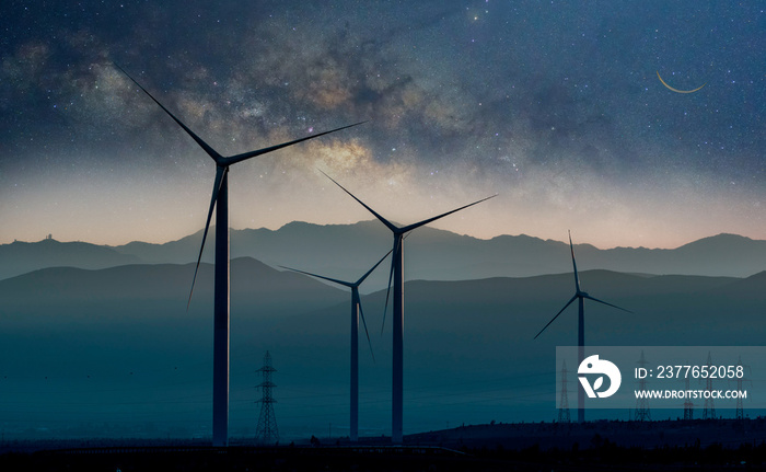 wind turbines in the desert of Atacama at night with Milky Way background