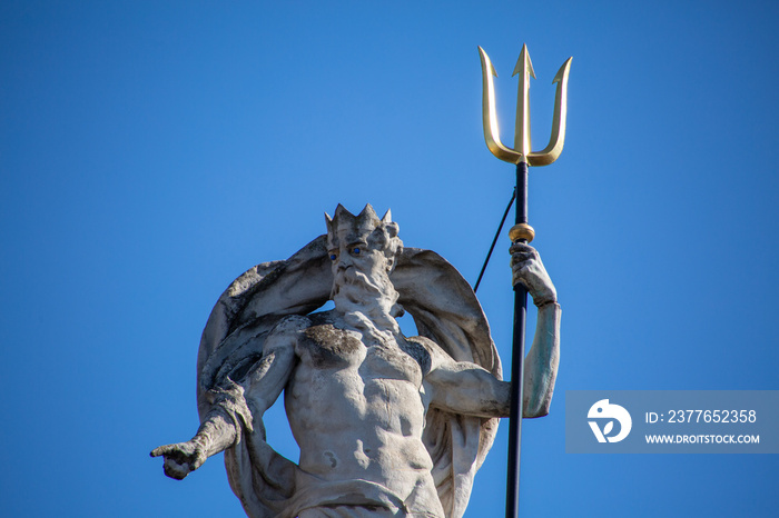 Poseidon statue in the city of Ghent with blue background