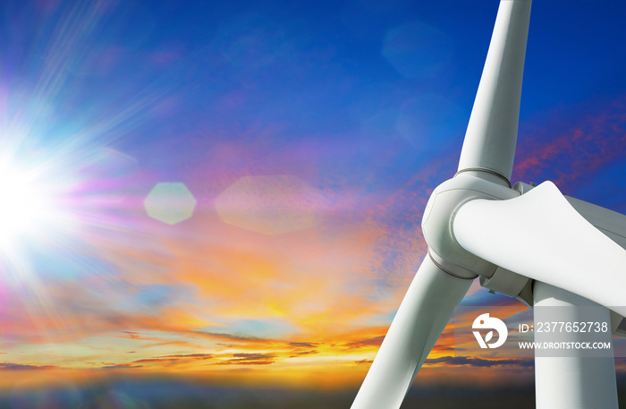 big wind turbine on blue sky background