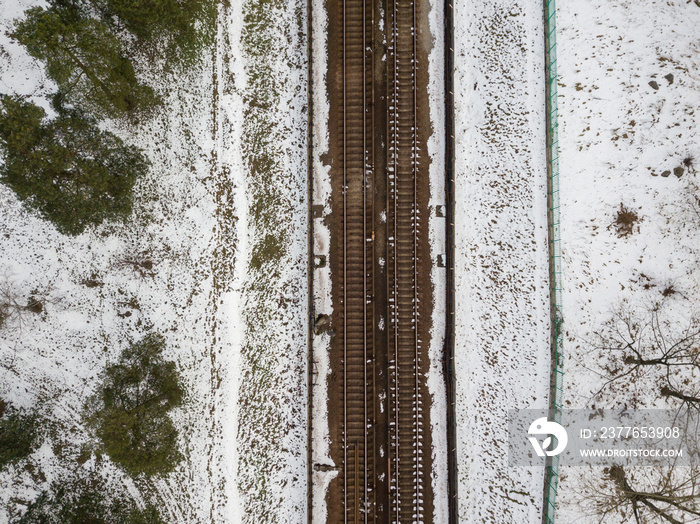 Kiev metro line in a snowy park. Aerial drone view. Winter snowy morning.