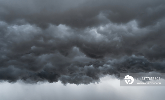 Dramatic dark grey clouds sky with thunder storm and rain. Abstract nature landscape background.