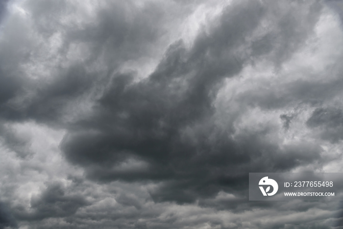 Scary and epic background - dramatic stormy weather sky with dark clouds before a thunderstorm.