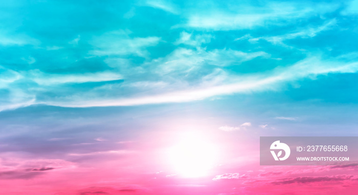 bright sunrise in blue green sky with low pink color in sky