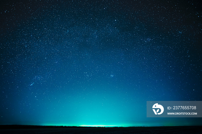 Night Sky Glowing Stars Background Backdrop With Sky Gradient. Colourful Night Starry Sky In Blue Aquamarine Colors