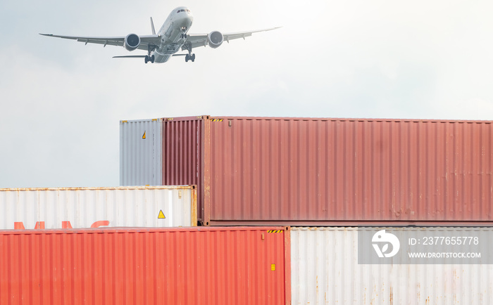 Air logistics. Cargo airplane flying above stack of logistic container. Cargo and shipping business. Container ship for export logistic. Logistic industry from port to port. Freight transportation.