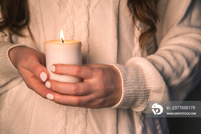 woman holding a candle