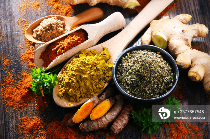 Composition with spices on wooden kitchen table