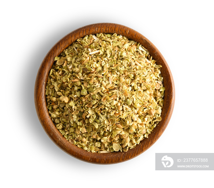 oregano in wood bowl isolated on white background, top view