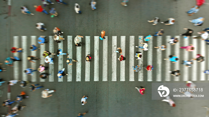 Aerial. Pedestrian motion on a crosswalk. Blurred.