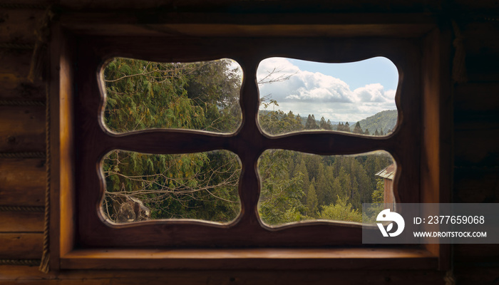 View of mountains from wooden traditional hut window